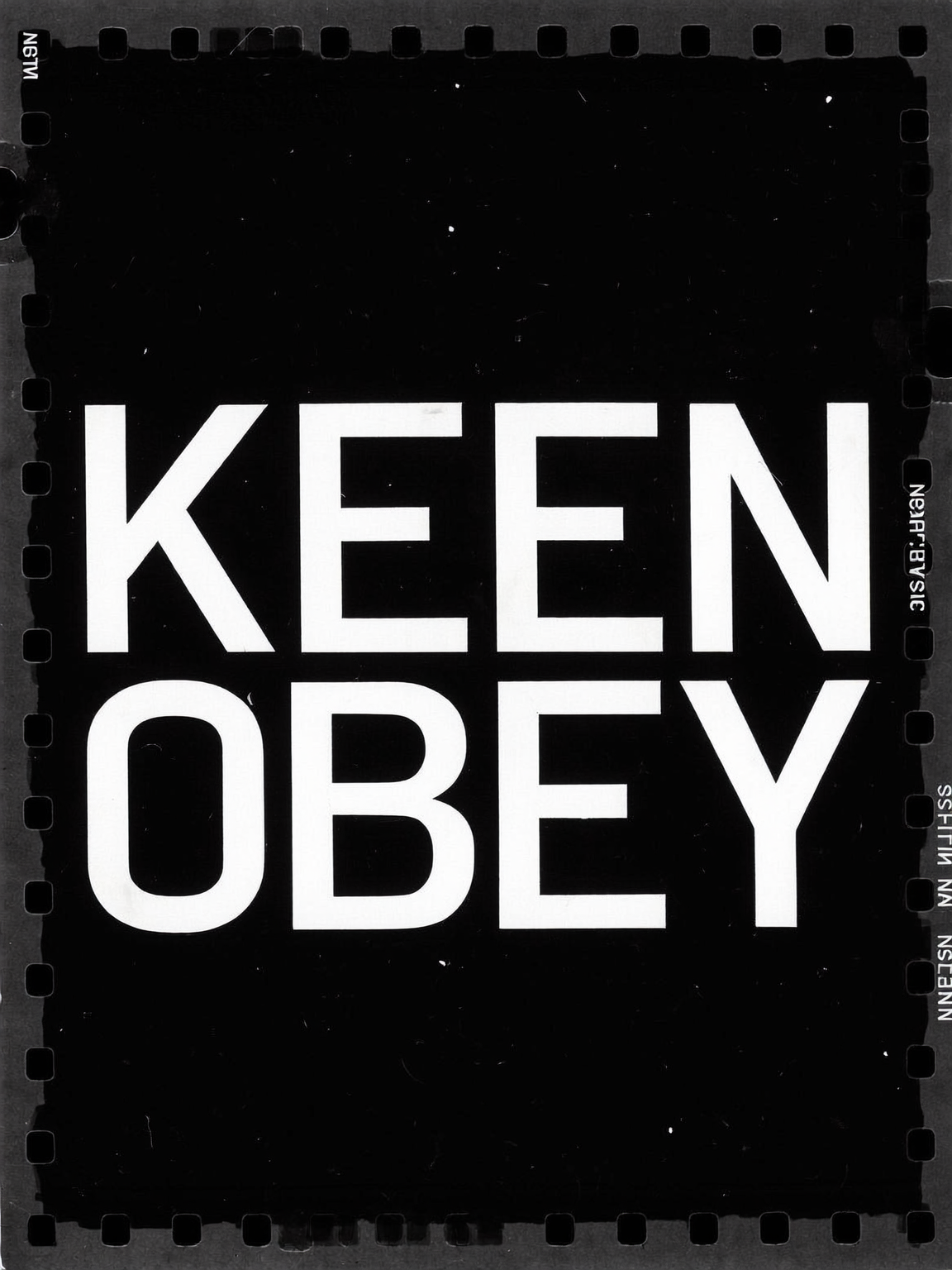 Illuminated KEEN OBEY sign
